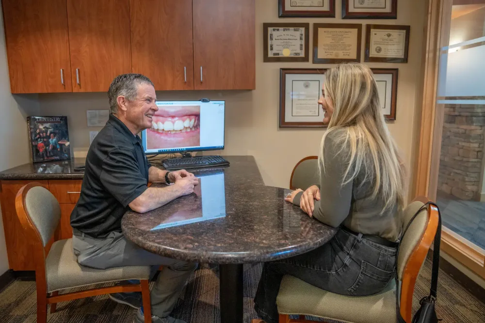 Dr. Middleton reviewing a treatment plan with a patient at Parkside Dental