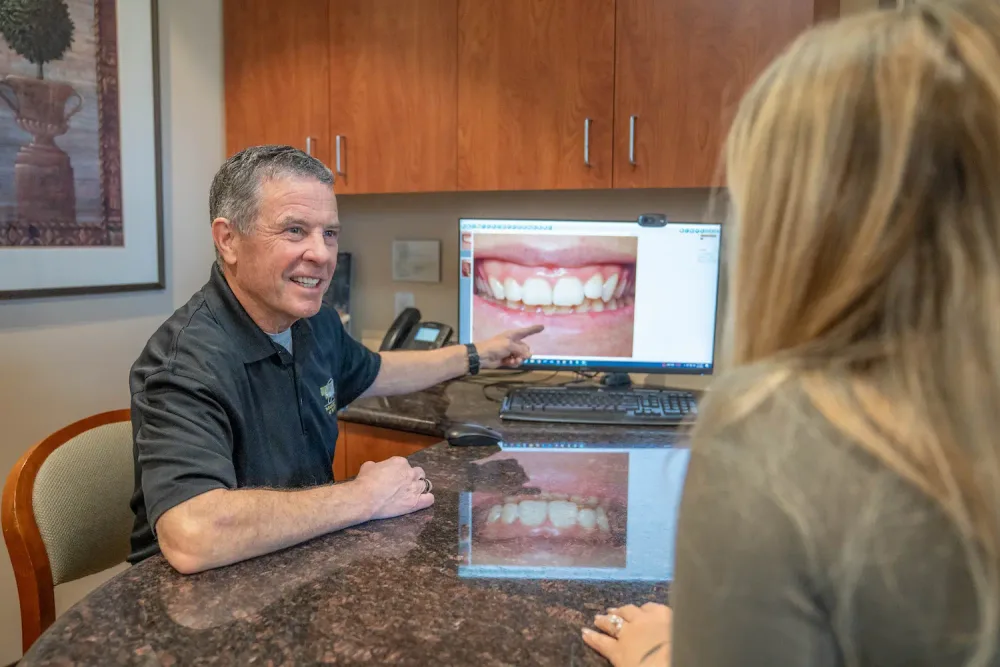 A Parkside Dental dentist talking through options with a patient